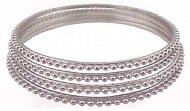 Set of 4 Silver Tone Bangles with Beaded Detailing